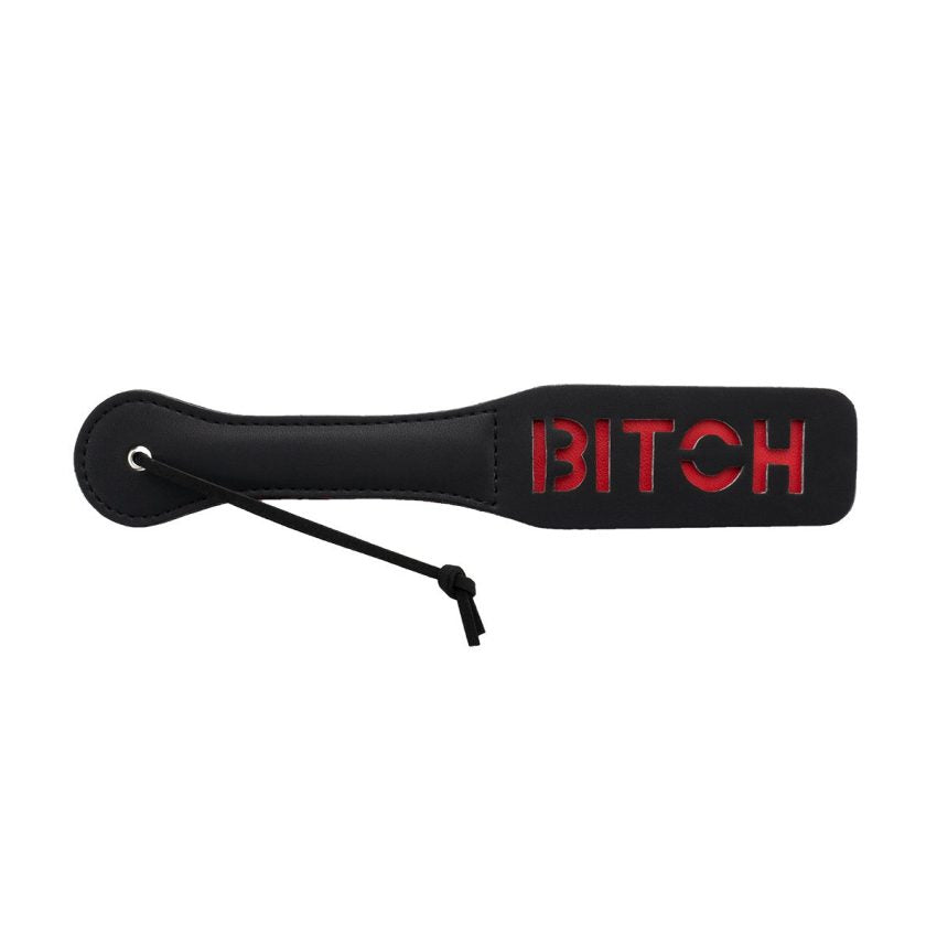 Paleta negra para nalgadas de Camtoyz, accesorio de BDSM con mango, abierta, diseñada para juegos eróticos de impacto.