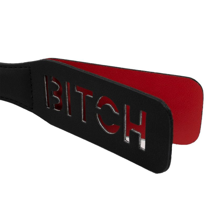 Paleta para nalgadas negra de la marca Camtoyz, accesorio de plástico abierto para juegos eróticos.