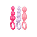 Plug anal Satisfyer Booty Call en colores vibrantes, diseñado para uso anal y placer íntimo.