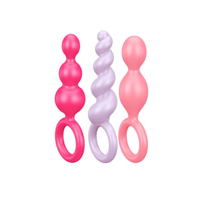 Plug anal Satisfyer Booty Call en colores vibrantes, diseñado para uso anal y placer íntimo.
