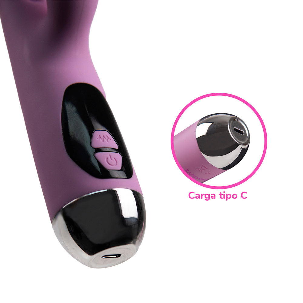 Vibrador tipo conejo Camtoyz Avery Majestic Pro de color rosa en una superficie blanca.