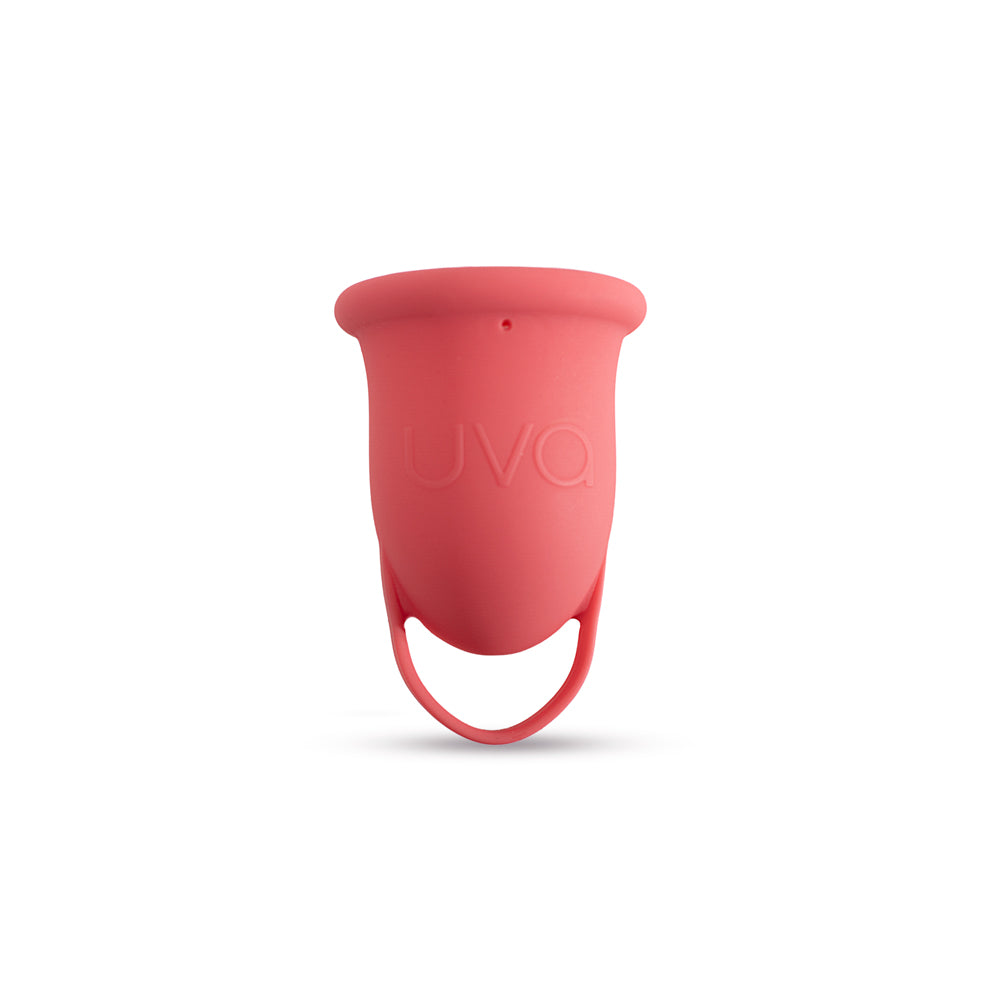 Copa menstrual UVA de gestión menstrual color salmón, talla A, en estado limpio sobre fondo neutro.