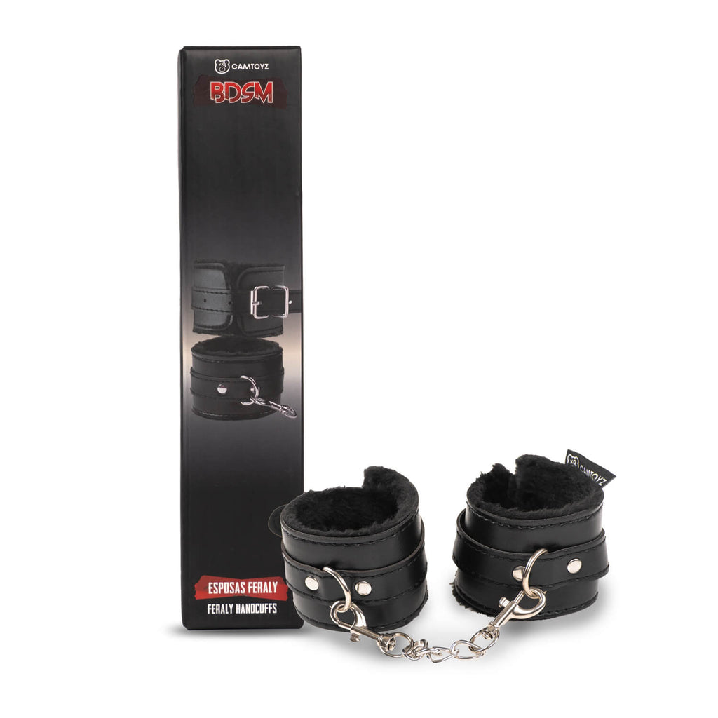 Esposas BDSM Feraly de la marca Camtoyz, hechas de acero con cierre de seguridad, en su caja de embalaje.