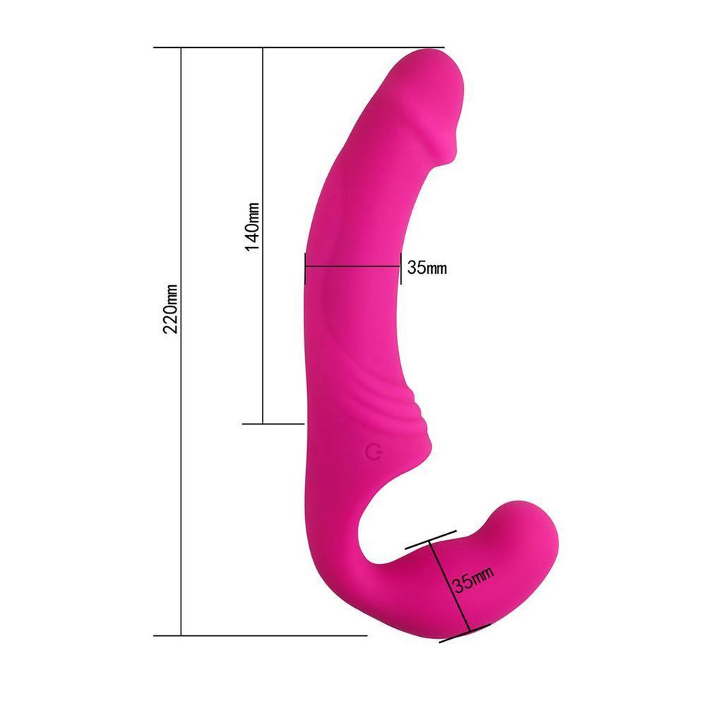 Vibrador doble Rider Fucsia de Distrisex para parejas, con diseño ergonómico y texturizado en color rosa vibrante.